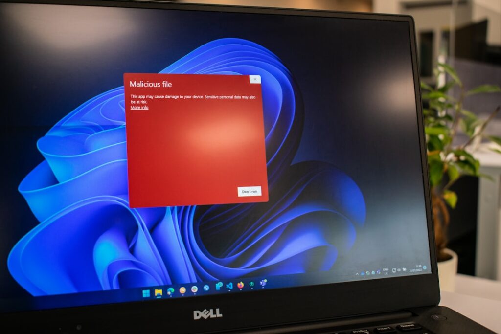A laptop showing a warning screen — illustrating a Singapore scam and cheating sentencing case study