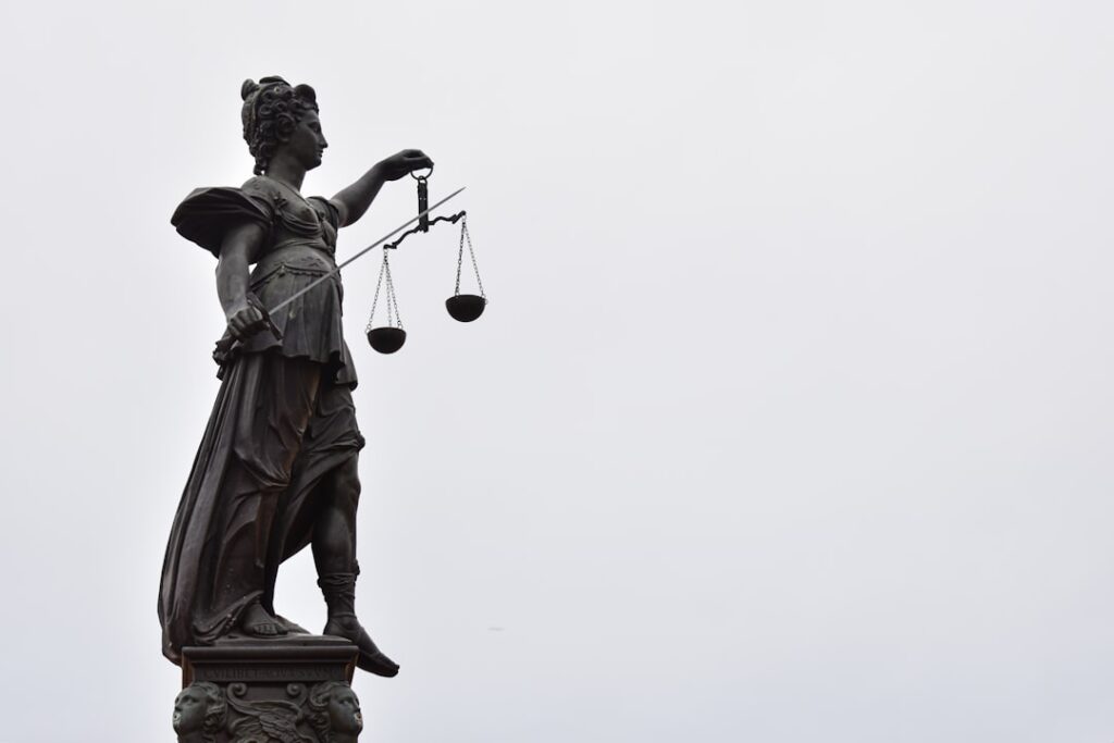 A statue of Lady Justice holding scales — illustrating a Singapore public-sector corruption case study