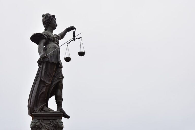A statue of Lady Justice holding scales — illustrating a Singapore public-sector corruption case study