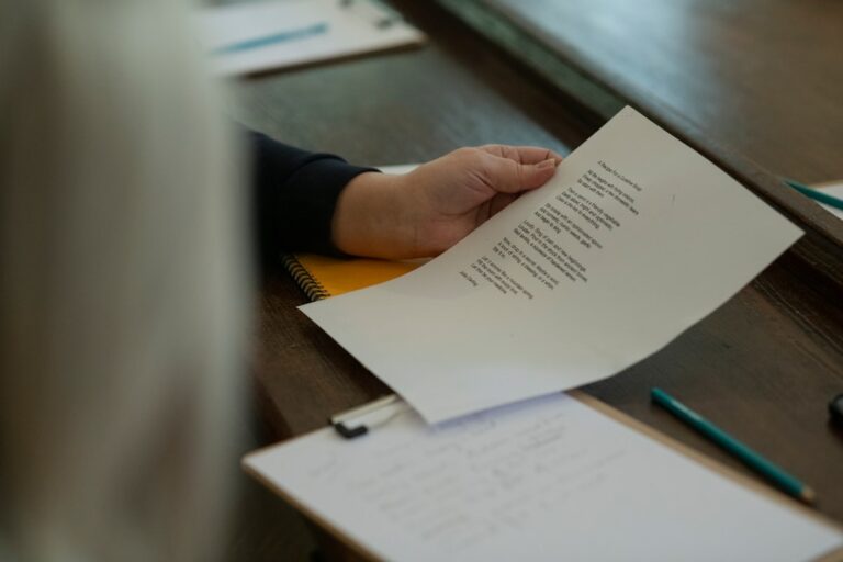 A person with a document at a desk — illustrating a Singapore false-information case study