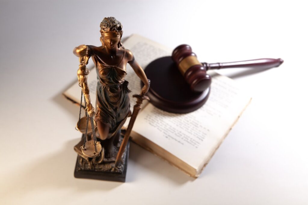 A statue of justice with a gavel and book — illustrating a Singapore kidnapping-for-ransom case study