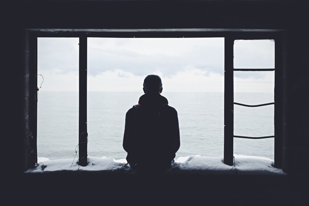 A young person by a window — illustrating a Singapore youth-sentencing case study