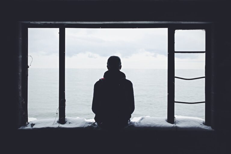 A young person by a window — illustrating a Singapore youth-sentencing case study