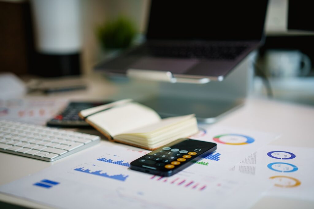 Office desk with financial charts — white-collar and commercial crime in Singapore