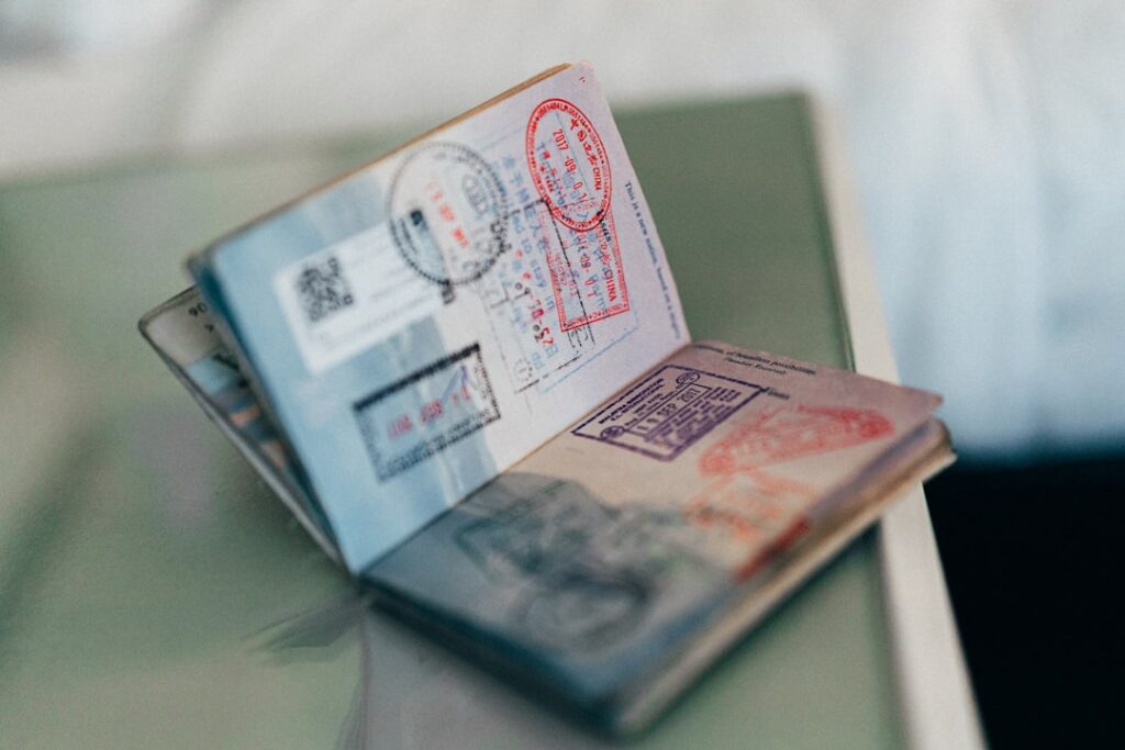 An open passport with entry stamps — illustrating a Singapore immigration and overstaying case study
