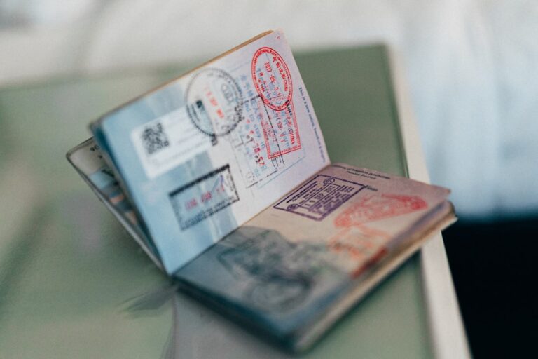An open passport with entry stamps — illustrating a Singapore immigration and overstaying case study