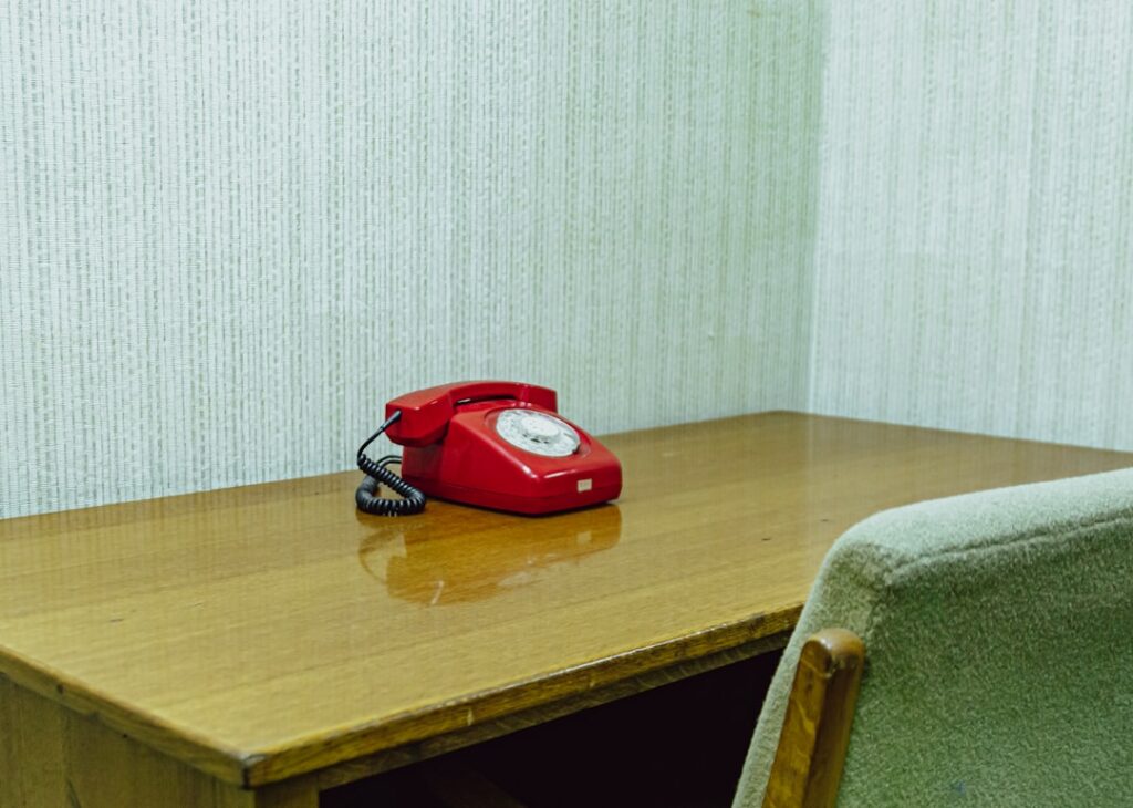 A desk telephone — making first contact with a criminal lawyer in Singapore