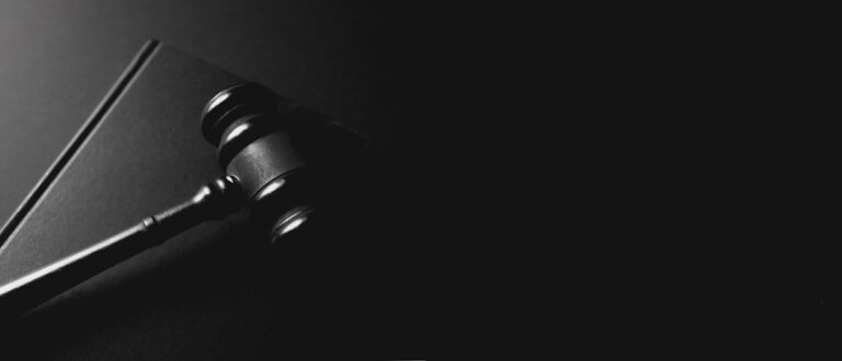 A gavel on a dark surface — illustrating a Singapore Arms Offences Act case study
