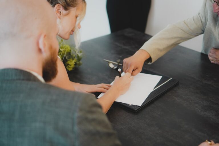 People reviewing documents at a desk — illustrating a Singapore sentencing-framework case study